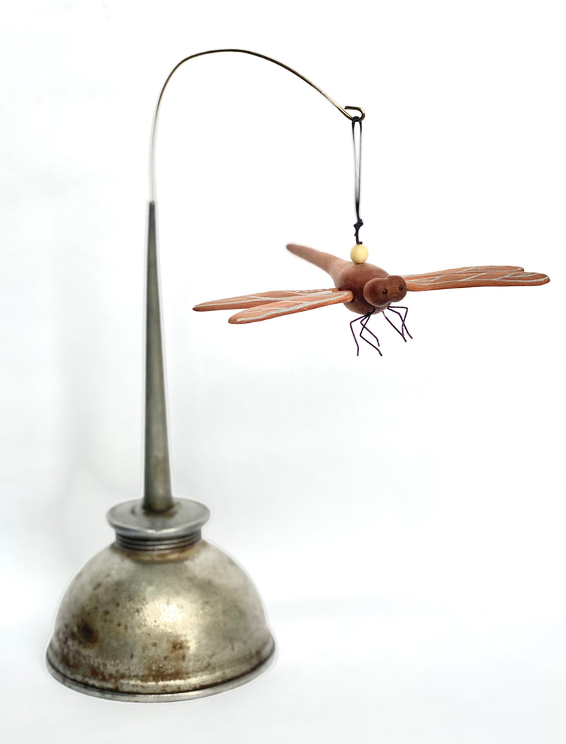 Dragonfly in Vintage oil can